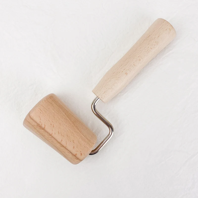 Rouleau conique à étaler la pâte